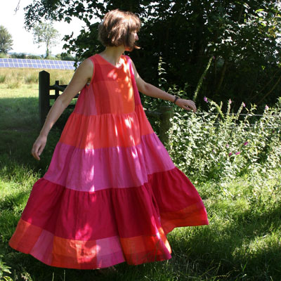 Sizzling hot colours for a bold bright sun-dress in Baird McNutt Irish linens. Each layer gathered onto the one above in a style reminiscent of the 1970s
